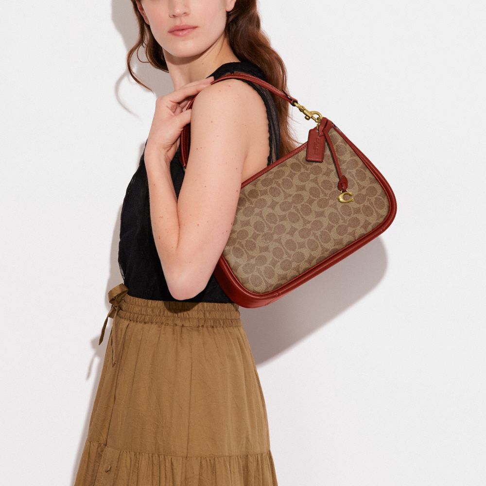 Női COACH® Cary In Signature Canvas Crossbody Táska Barna Piros | HUILR768